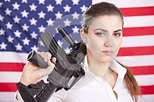 Woman with machine gun over american flag