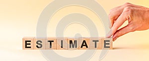 Woman made word estimate with wood blocks