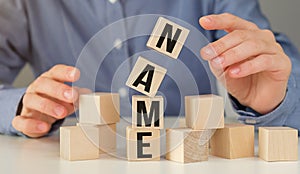 Woman made word NAME with wood blocks