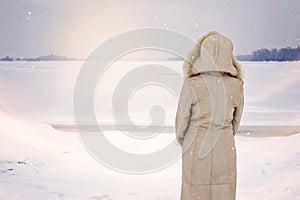 Woman and Magic Winter Close to the Frozen River