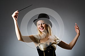 Woman magician with magic wand