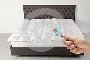 Woman with magnifying glass detecting bed bugs on mattress