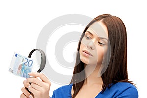 Woman with magnifying glass and euro cash money