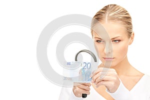 Woman with magnifying glass and money