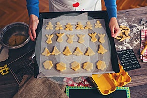 Woman make ginger bread for Christmas