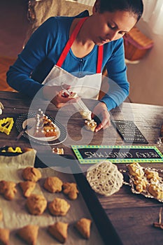 Woman make ginger bread for Christmas