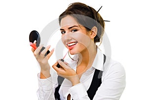 Woman make makeup with lipstick