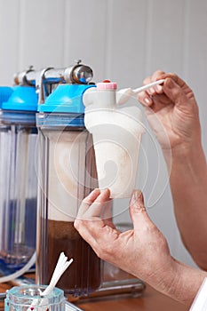 Woman make oxygen cocktail