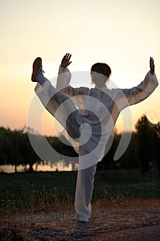 Woman make's taiji chuan exercise photo