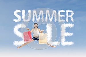 Woman make summer sale sign