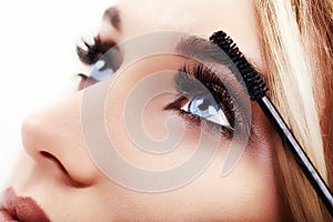 Woman Make-up Applying closeup. Eyeliner