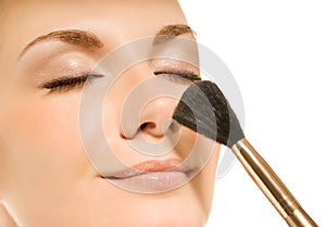 Woman with a make-up brush