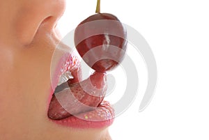 Woman with make-up licks cherry