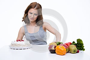 Woman makes choice between cakes