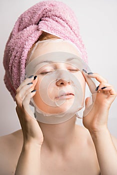 Woman makes a cosmetic mask anti-wrinkle