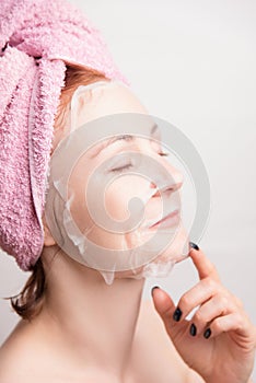 A woman makes a cosmetic mask for moisturizing the skin