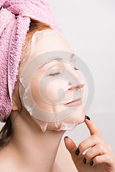 A woman makes a cosmetic mask for moisturizing the skin
