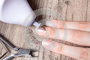 A woman makes her own hardware manicure at home. Close up. Manicure set. Dangerous. Nails. Home care, salon, Spa, beauty, health.