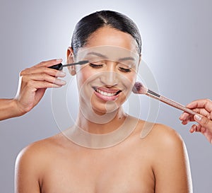 Woman, makeup brush and studio for beauty, hands and cosmetics on gray background. Cosmetology, smile and mascara for