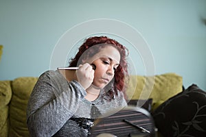 Woman makeup at home.