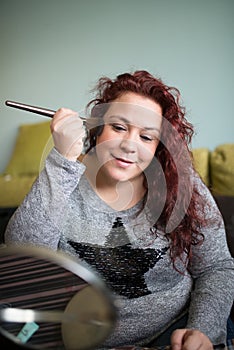 Woman makeup at home.