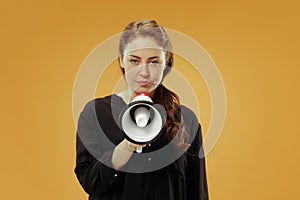 Woman making announcement with megaphone