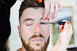 Woman making beauty and make up treatment in a saloon.