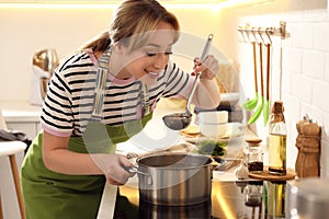 Woman making bouillon on stove. Homemade recipe