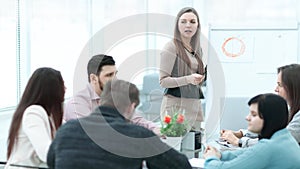 Woman making a business presentation to a group