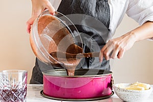 Woman making cake in her kitchen