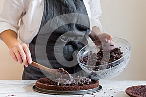 Woman making cake in her kitchen