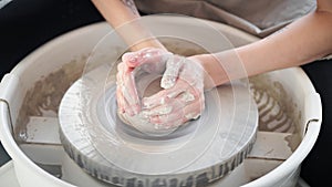 Woman making ceramic pottery on wheel, creation of ceramic ware. Concept for small business or hobby