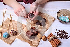 Woman making chocolate popcakes. Cake pops making. Pop cakes.