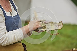 Woman making clay oven at the Viking festival