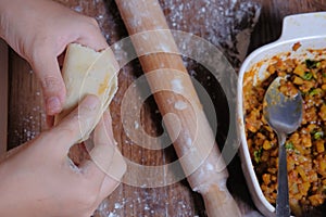 Woman making curry puff