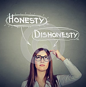 Woman making a decision honesty vs dishonesty photo