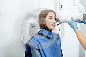Woman making dental x-ray shot