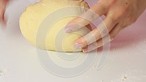 Woman making dough and cooking healthy food at home