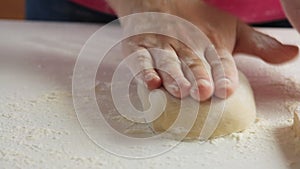 Woman making dough and cooking healthy food at home