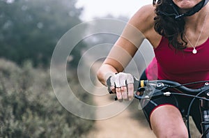 Woman making downhill with mountain bike. Concept about people a