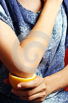 Woman making an elbow treatment