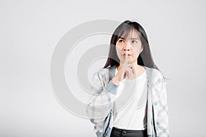 Woman making finger on lips mouth silent quiet gesture