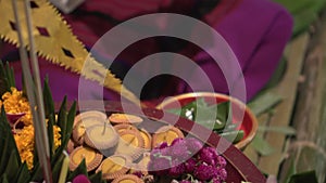 Woman making floating loi krathong made from banana leave and decorate with orchid flower