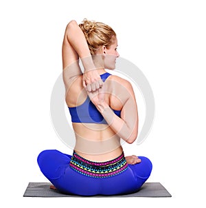 Woman making Gomukhasana yoga asana