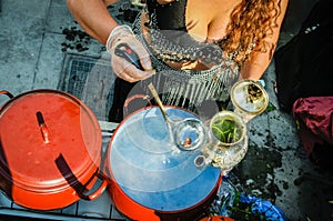 Woman making herbal tea or infusion