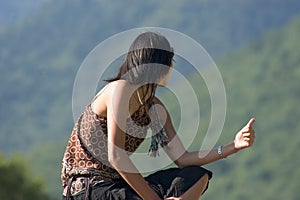 Woman making of hitch-hiking