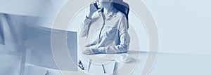 Woman making important business call in the office. Career concept. Duotone effect