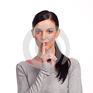 Woman making a keep it quiet - isolated