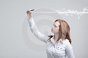 Woman making magic effect - flash lightning. The concept of copywriting or writing. photo