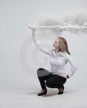 Woman making magic effect - flash lightning. The concept of electricity, high energy.